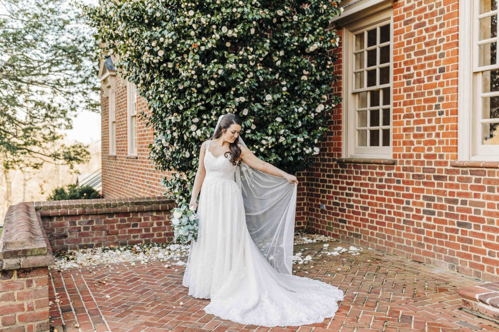 Bride standing in front of the ivy during Bridal Portraits at The Estate at River Run